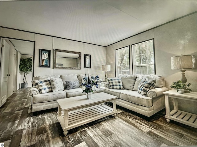 living room with ornamental molding and wood-type flooring