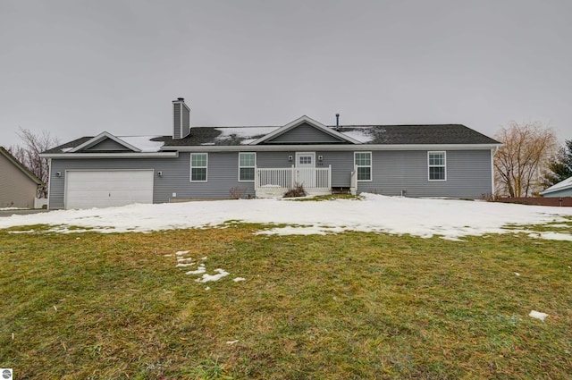 view of front facade with a garage and a front lawn