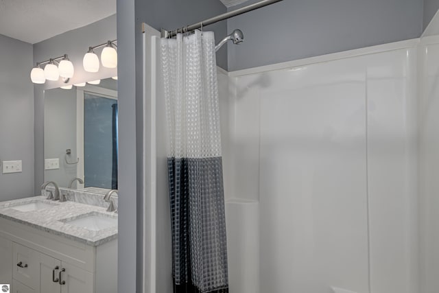 bathroom featuring vanity and walk in shower