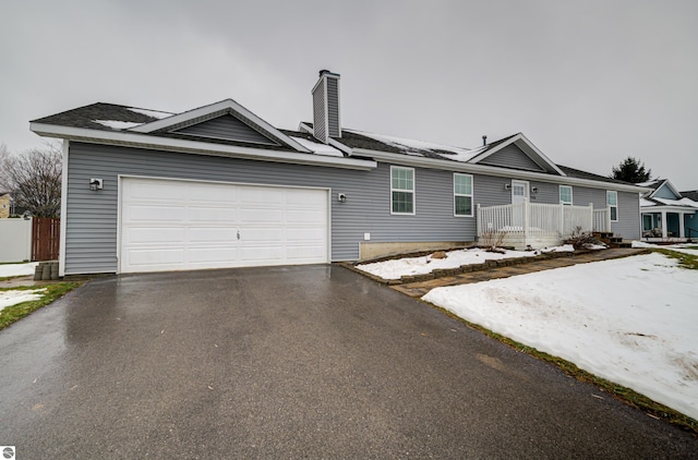 single story home with a garage