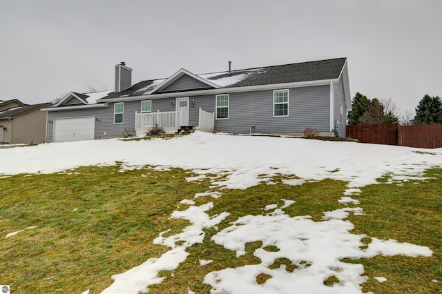 view of front of home featuring a garage and a front lawn