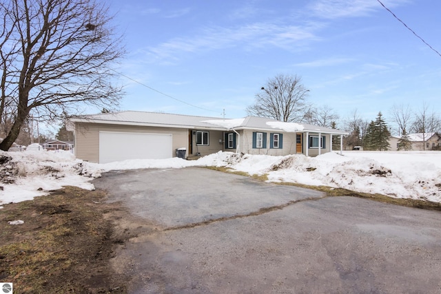 single story home with a garage