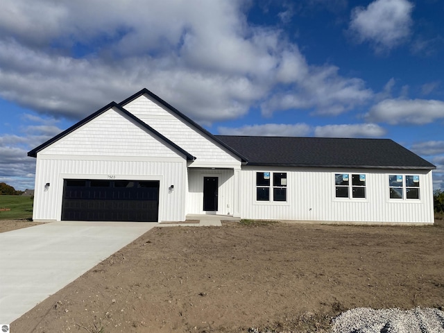 modern farmhouse featuring a garage