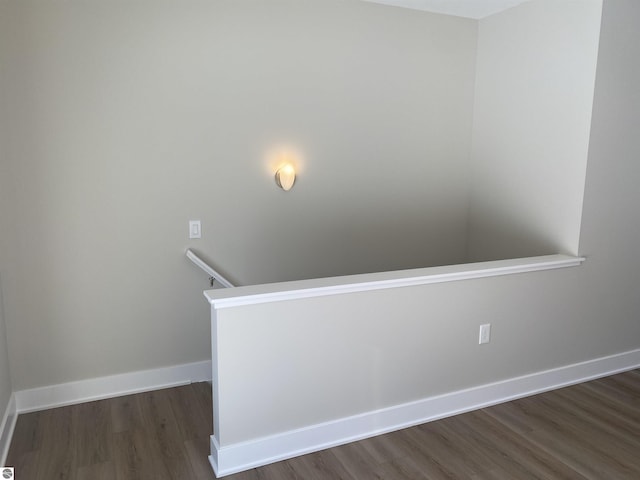 stairs featuring hardwood / wood-style floors