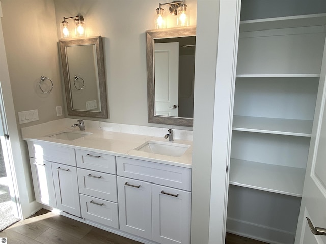 bathroom featuring vanity and hardwood / wood-style flooring