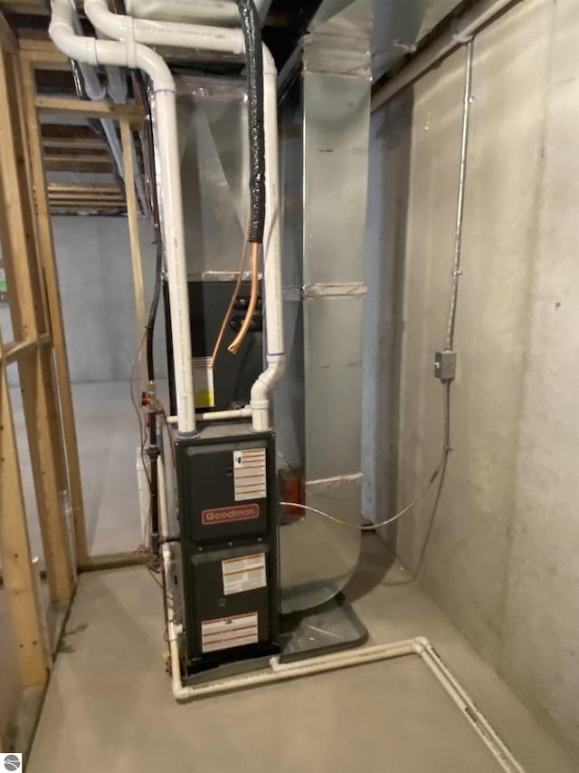 utility room with heating unit