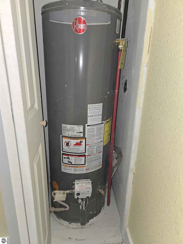 utility room with water heater