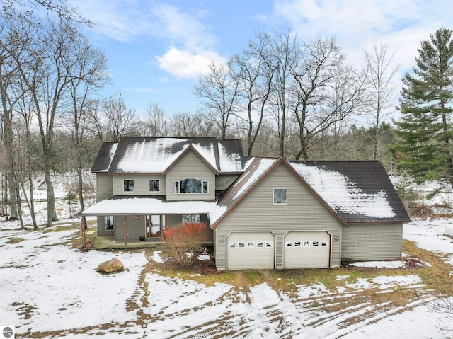 view of front facade with covered porch and a garage