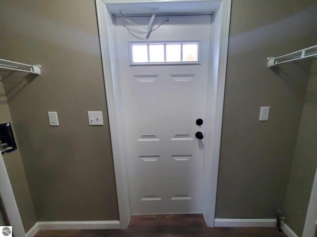 doorway to outside featuring dark hardwood / wood-style floors