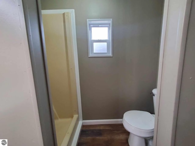 bathroom featuring hardwood / wood-style floors and toilet