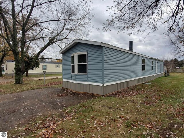 view of property exterior featuring a yard