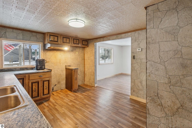 kitchen featuring hardwood / wood-style floors and sink