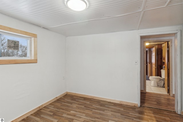 spare room with hardwood / wood-style flooring