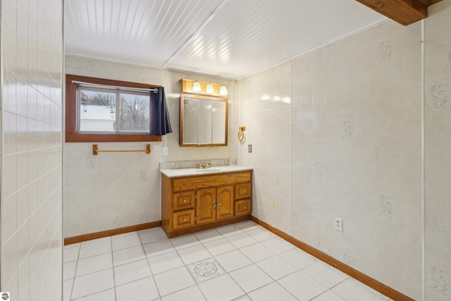 bathroom with tile patterned floors and vanity