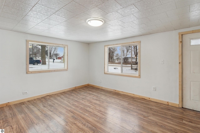 empty room featuring hardwood / wood-style floors