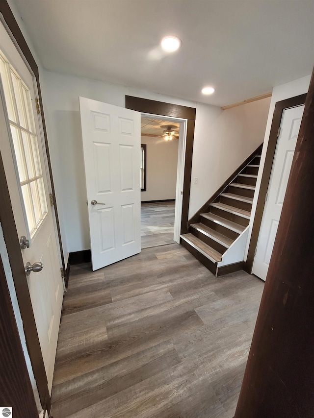 hall with hardwood / wood-style flooring