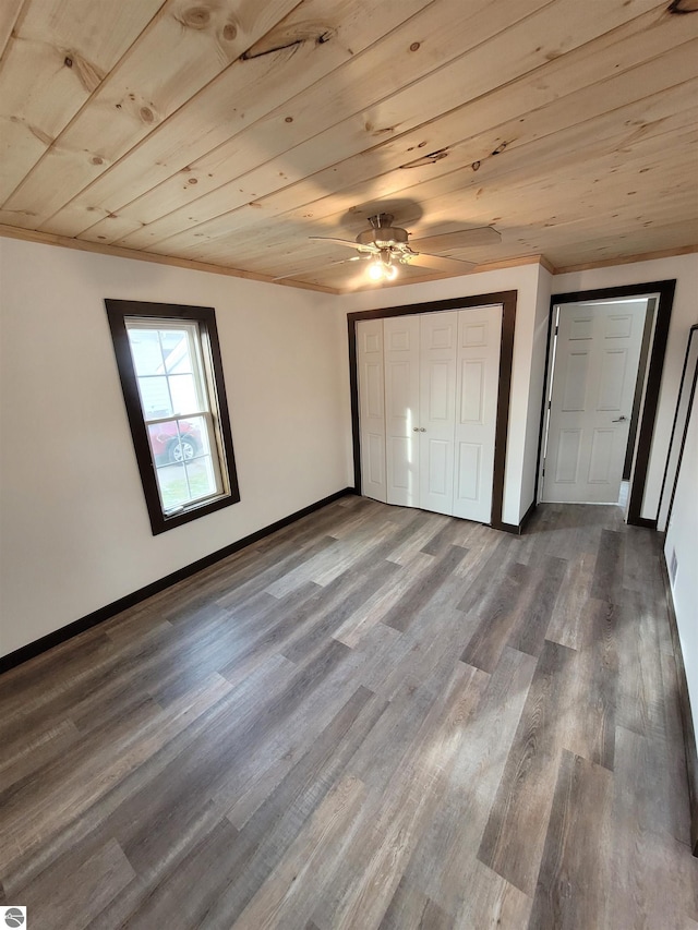 unfurnished bedroom with hardwood / wood-style floors, ceiling fan, wooden ceiling, and ornamental molding