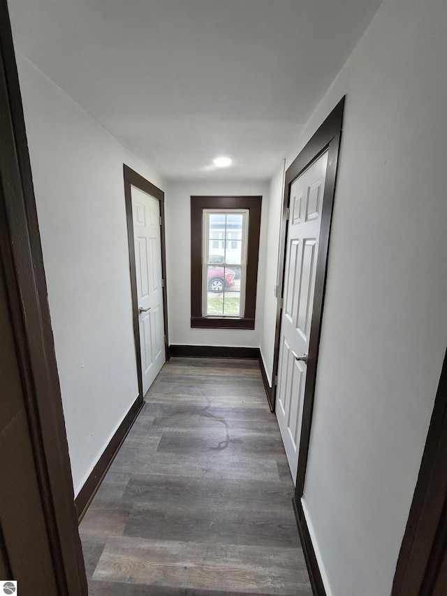 corridor featuring dark wood-type flooring