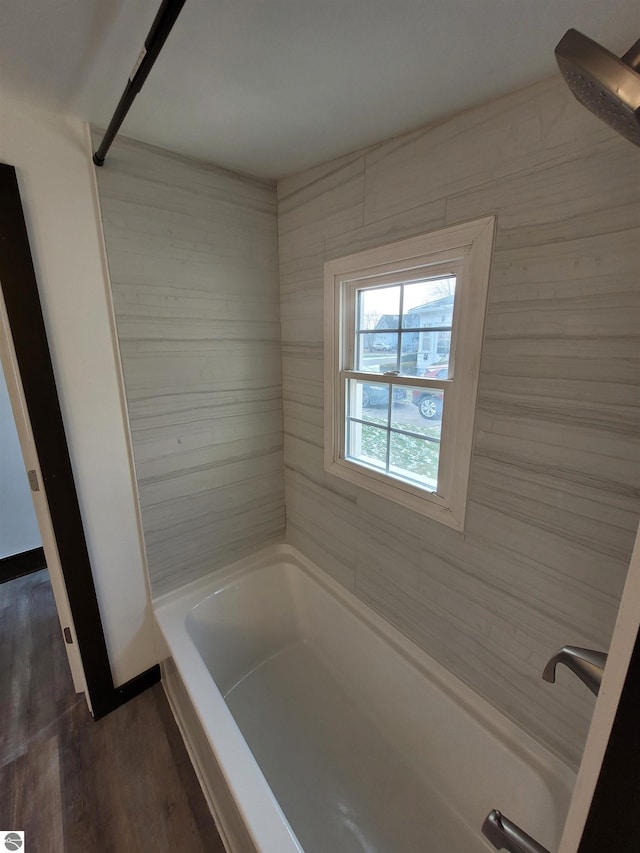 bathroom featuring shower / bathing tub combination and wood-type flooring