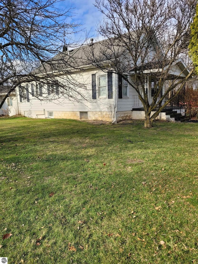 view of home's exterior featuring a lawn