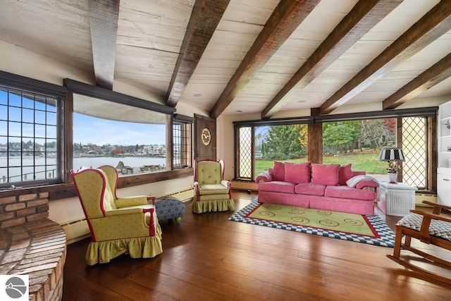 living room featuring beam ceiling, hardwood / wood-style floors, and a water view