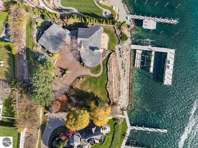 birds eye view of property with a water view