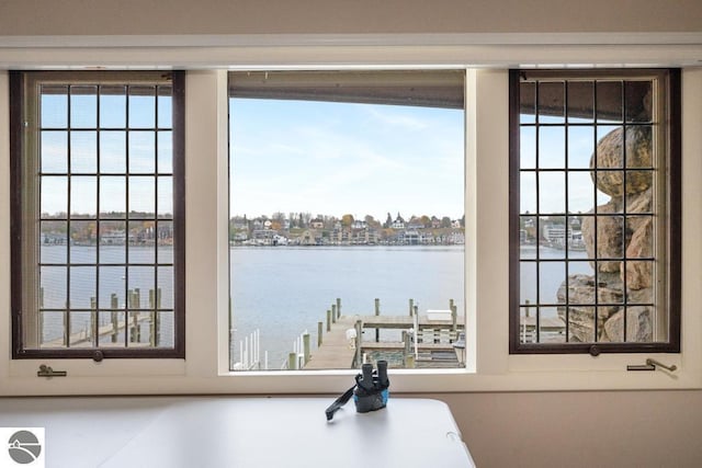 doorway to outside with a water view