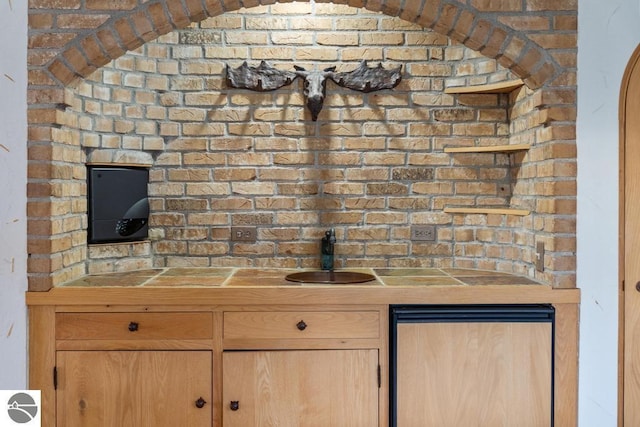 kitchen featuring light brown cabinetry