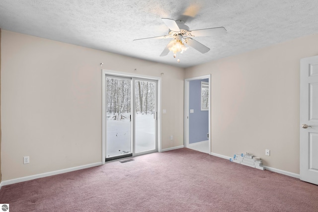 unfurnished bedroom with carpet, ceiling fan, and a textured ceiling