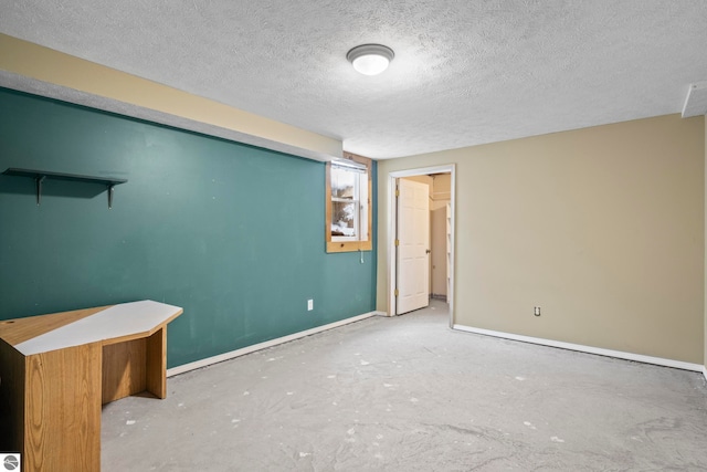 interior space with concrete flooring and a textured ceiling