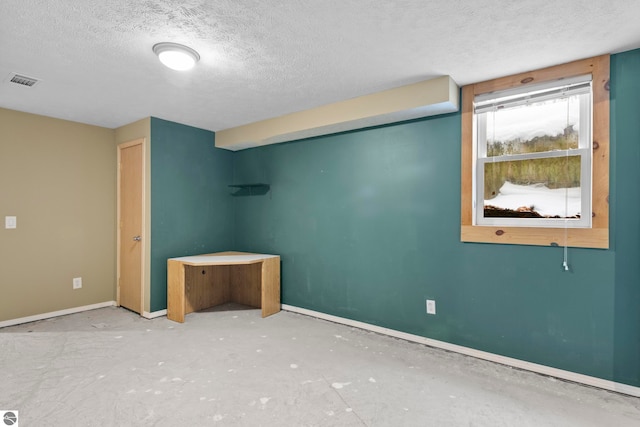 unfurnished bedroom with a textured ceiling