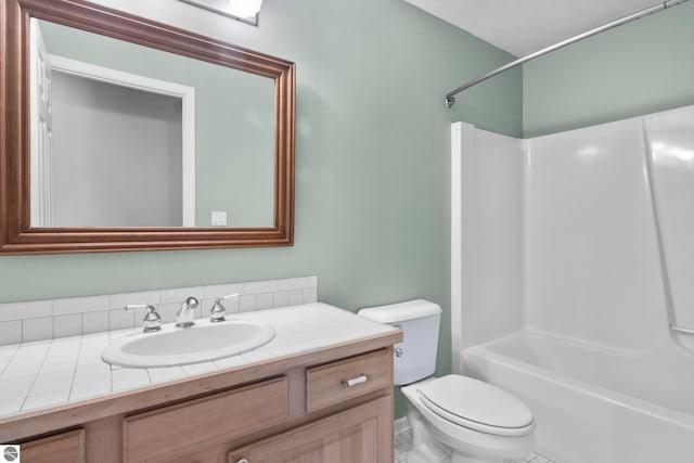 full bathroom with tile patterned floors, vanity, shower / bathing tub combination, and toilet