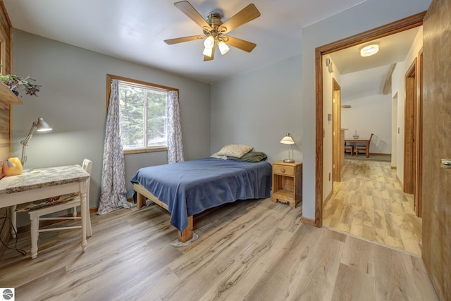 bedroom with ceiling fan and light hardwood / wood-style flooring