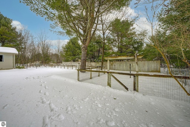 view of yard layered in snow