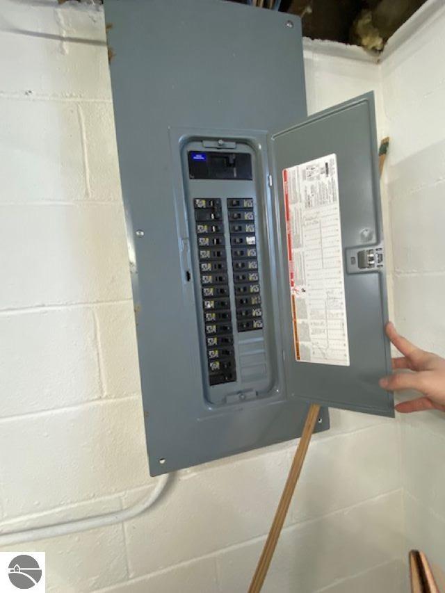 utility room featuring electric panel