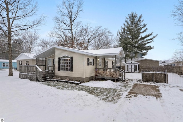 exterior space featuring a storage shed and a wooden deck