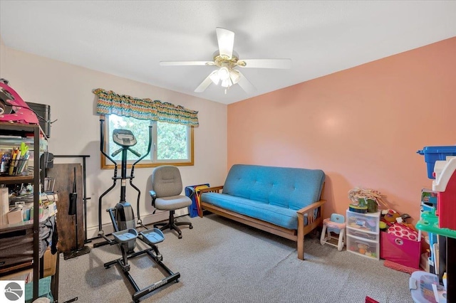 workout area featuring carpet floors and ceiling fan