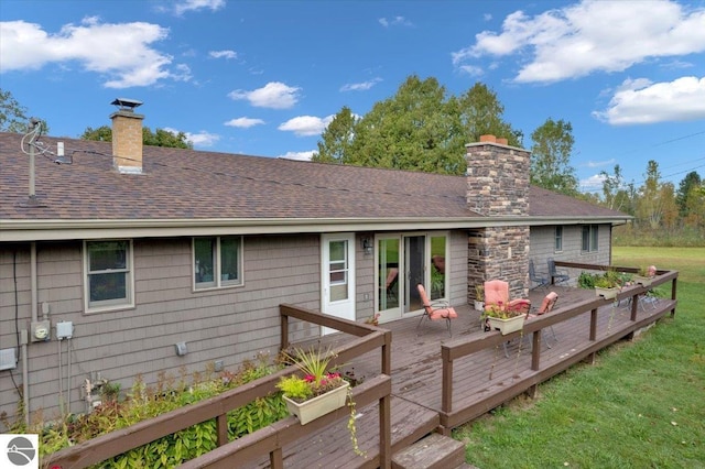 rear view of property featuring a wooden deck and ac unit