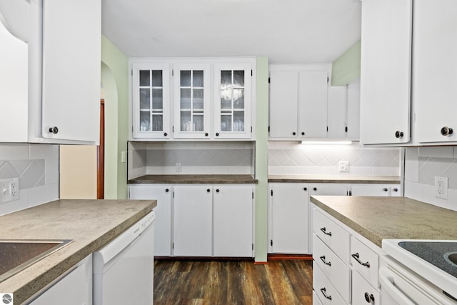 kitchen with tasteful backsplash, dark wood finished floors, white cabinets, and dishwasher