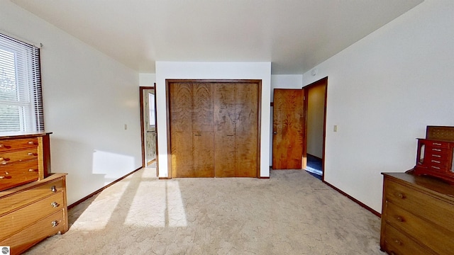 carpeted bedroom featuring a closet