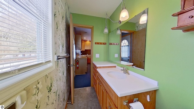 bathroom with tile patterned floors and vanity