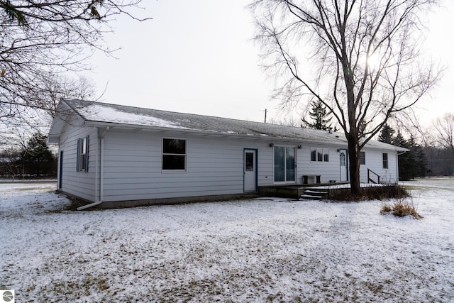 view of snow covered house