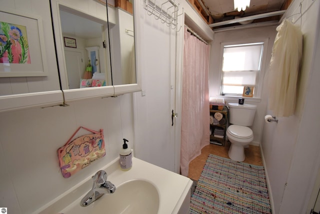 bathroom with toilet and sink