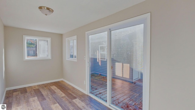 unfurnished room with light hardwood / wood-style flooring