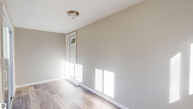 unfurnished room featuring light wood-type flooring