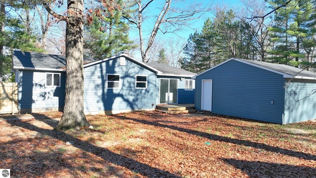 rear view of property with a yard