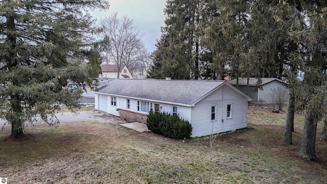 rear view of property with a lawn