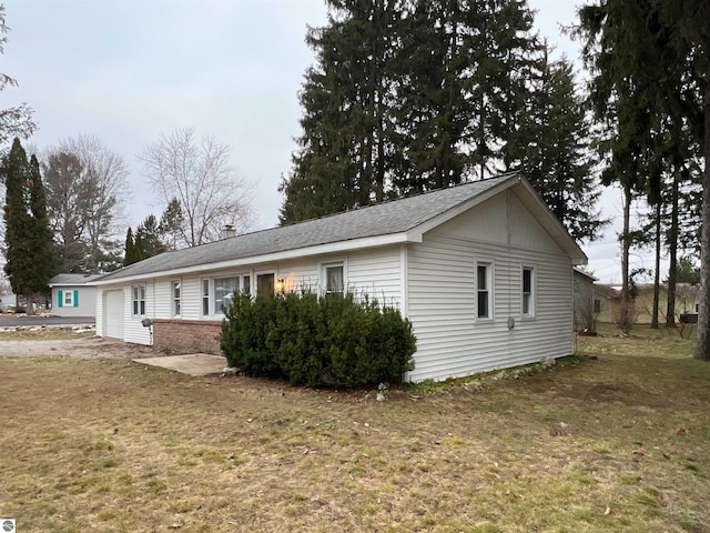 view of home's exterior with a yard