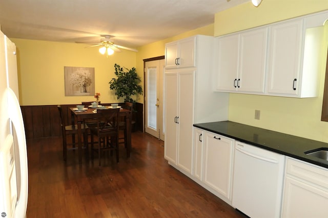 kitchen featuring white cabinetry, ceiling fan, dark hardwood / wood-style floors, and white appliances