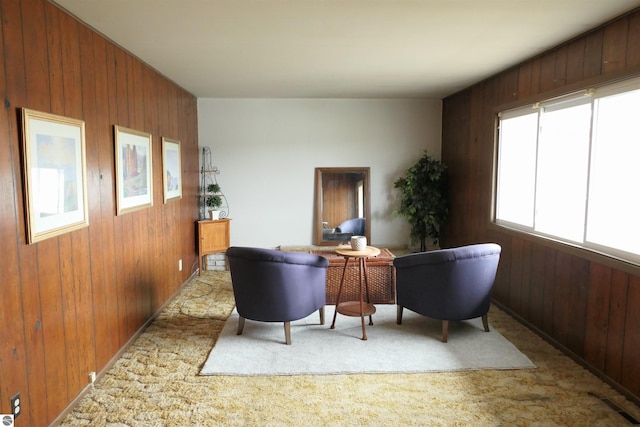 interior space with wooden walls and light carpet